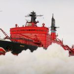 The helicopter flies up to the icebreaker