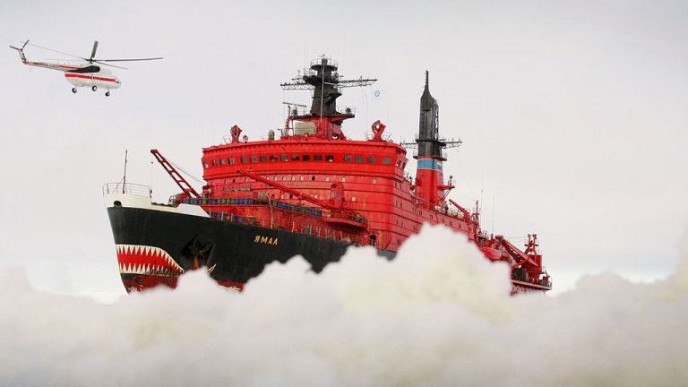 The helicopter flies up to the icebreaker