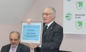 Stanislav Belikov with a diploma